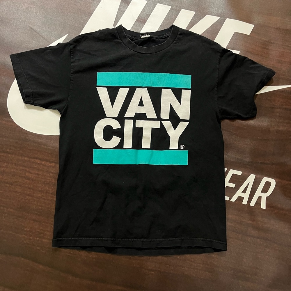 Blue and Black Vancity t-shirt. Size: M/L